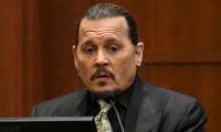Johnny Depp mouths 'wow' over a reply from a witness to Amber Heard's lawyer