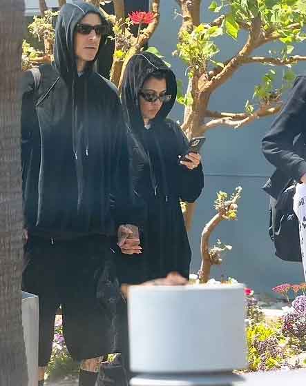 Kourtney Kardashian and Travis Barker cut a casual figure as they return home