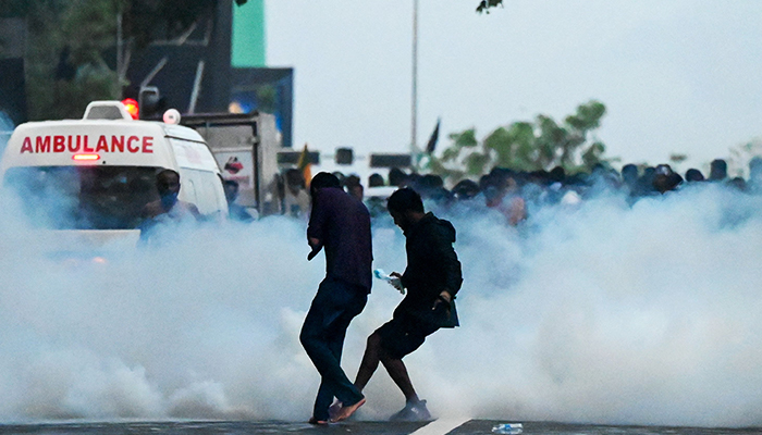 Police use tear gas shells to disperse students taking part in an anti-government protest demanding the resignation of Sri Lankas President Gotabaya Rajapaksa over the countrys crippling economic crisis, in Colombo on May 29, 2022. — AFP