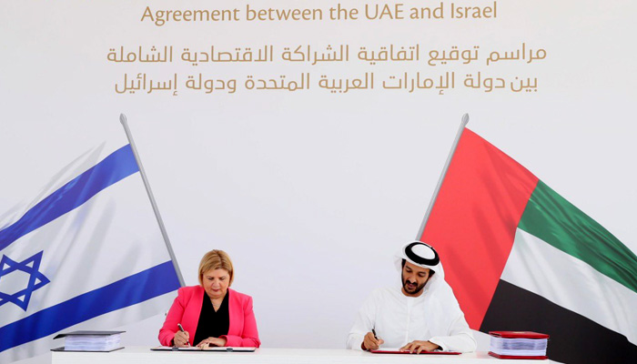 Israeli and Emirati officials signing the free trade deal today. Picture UAE envoy to Israel