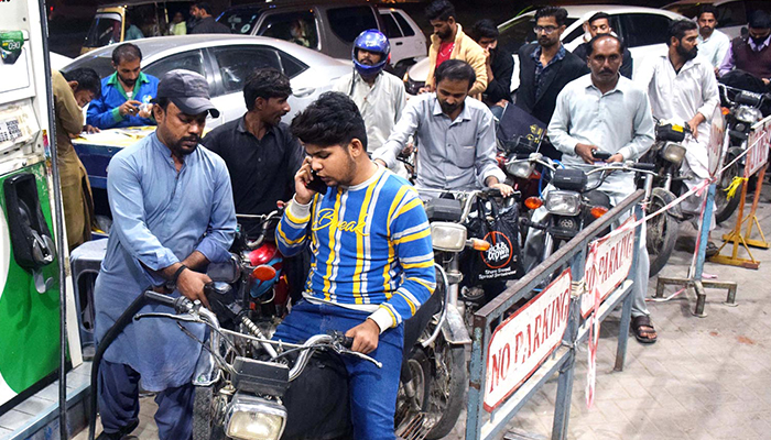 A large number of bikers can be seen at a petrol pump at Qasimabad, Hyderabad, on November 24, 2021. — INP