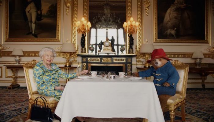 Queen Elizabeth takes tea with Paddington Bear in surprise on-screen appearance