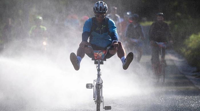 Slovenians race to celebrate legendary fold-up bike