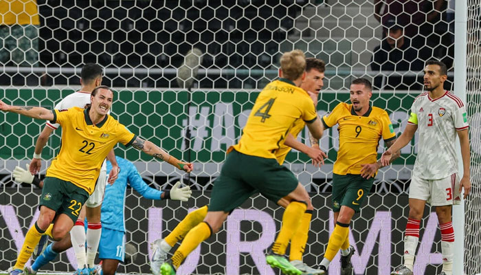 Ajdin Hrustic (C behind) scored a late winner to put Australia one victory away from a place at the World Cup. Photo: AFP