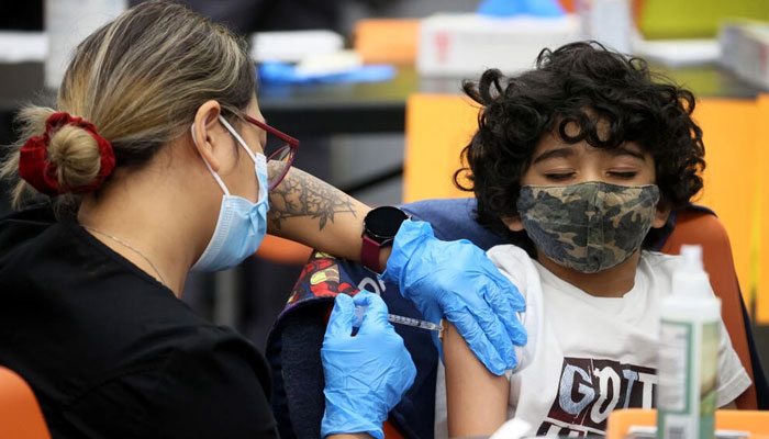 A seven-year-old receiving a Covid-19 vaccine at Michele Clark High School in Chicago, Illinois in 2021: the FDA is to discuss vaccines for even younger children, aged between six months and five years, next week. Photo: AFP/File