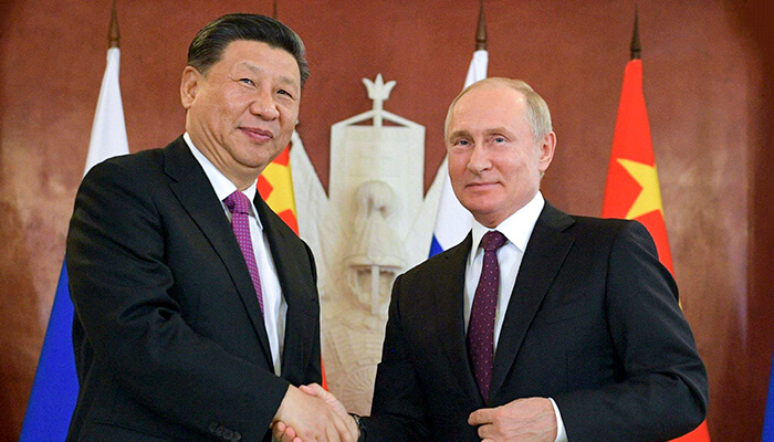 Russian President Vladimir Putin and his Chinese counterpart Xi Jinping shake hands after their talks in the Kremlin in Moscow on June 5, 2019. —AFP
