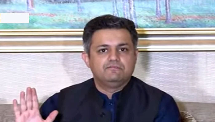 Former minister for energy Hammad Azhar is addressing a press conference in Lahore on June 18, 2022. — Geo News
