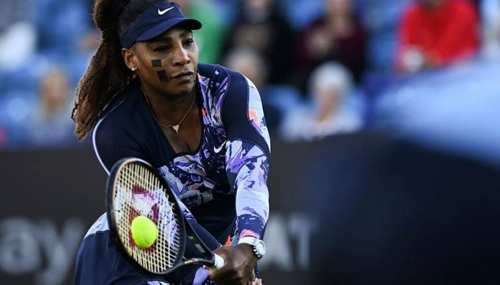 Serena Williams in doubles action at Eastbourne. Photo: AFP