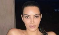 Kim Kardashian Shares Flashback Picture Of Herself Lying In Pool Of Water