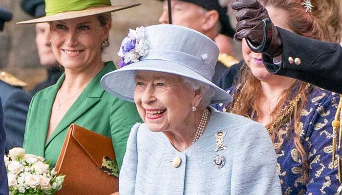 Queen appears in high spirits as she arrives in Edinburgh