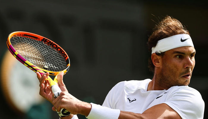 Nadal and Swiatek survive wobbles to progress at Wimbledon