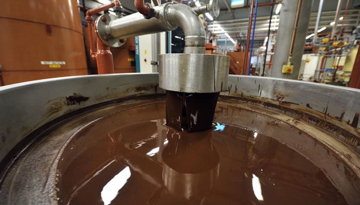 Barry Callebauts plant in Wieze, Belgium, produces liquid chocolate in wholesale batches for 73 clients making confectionaries. Photo: AFP/File
