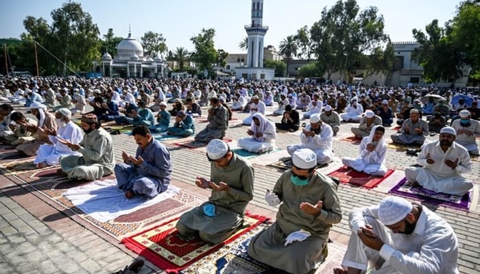 People offering Eid-ul-Azha prayers with COVID-19 protocols. -APP/file