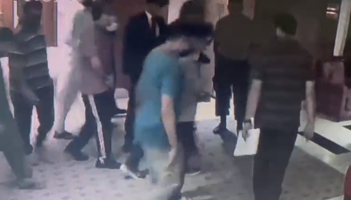 CCTV footage shows Haleem Adil being taken away by men in plain clothes from a Lahore hotel room.