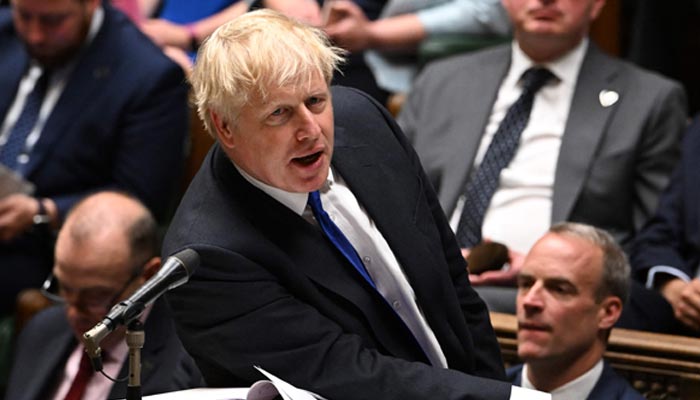 A handout photograph released by the UK Parliament shows Britains Prime Minister Boris Johnson during prime ministers questions in the House of Commons in London on July 6, 2022.— AFP/File