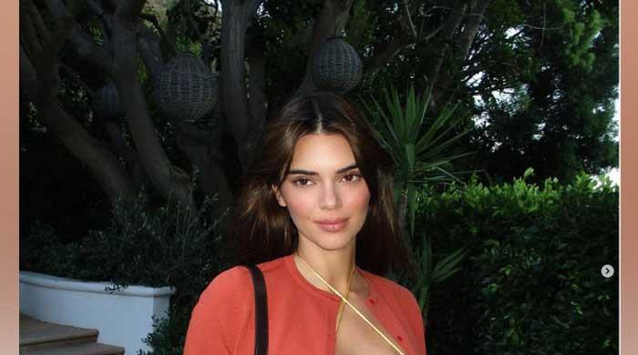 Kendall Jenner shares eye-popping snaps in yellow string tiny top to ...