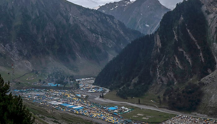 In this photograph taken on July 9, 2022, an aerial view of the tents wherein the Hindu pilgrims take rest due to bad weather, at Baltal base camp during the Amarnath pilgrimage in Kashmir. — AFP