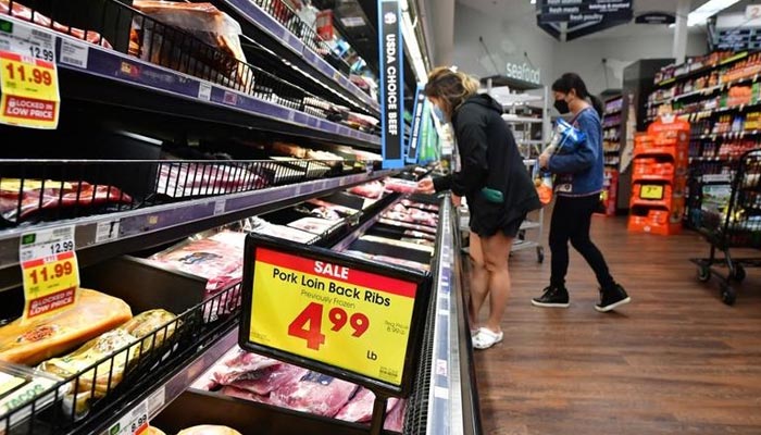 People shop at a grocery store in Monterey Park, California, on April 12, 2022. — AFP/File