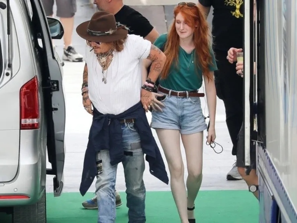 Johnny Depp steps out in Italy with a red-haired mystery woman, concert rehearsal pics go viral