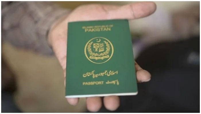 A person holding a Pakistani passport. — AFP.