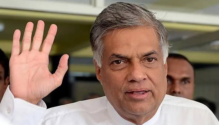 Ranil Wickremesinghe gestures to supporters in this file photo by AFP