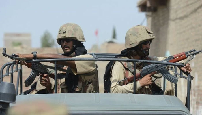 A representational image of Pakistan Armys soldiers holding guns. — AFP/File