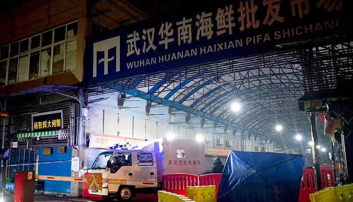 Police in Wuhan, China, shut down the Huanan Seafood Wholesale Market on 1 January, 2020. -AFP