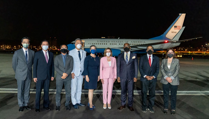 This handout picture taken and released by Taiwans Ministry of Foreign Affairs (MOFA) on August 2, 2022 shows Speaker of the US House of Representatives Nancy Pelosi posing with her delegation upon their arrival at Sungshan Airport in Taipei. -AFP