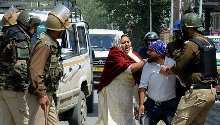 Indian security personnel detain a Kashmiri man during protests by students in Srinagar. — AFP/File
