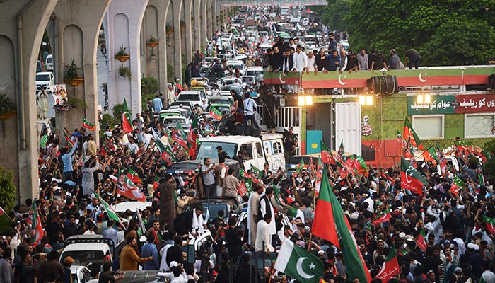 Supporters of the opposition party Pakistan Tehreek-e-Insaf (PTI) march during a protest rally against inflation, political destabilisation and continued hikes in fuel prices, in Rawalpindi on July 2, 2022. — AFP/File