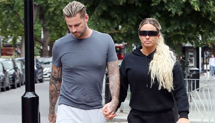 Katie Price confuses fans over romance with Carl Woods