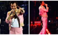 Harry Styles cuts dapper figure in flamboyant outfit as he performs in Toronto 