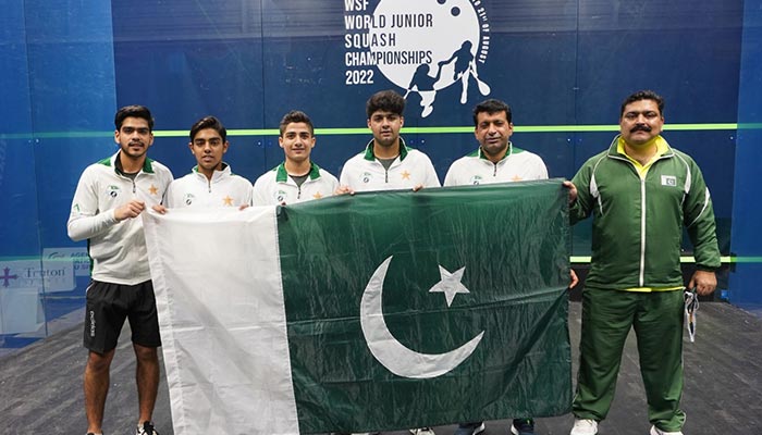 Pakistan team hold the countrys flag at the World Junior Squash Championship. — Photo by author