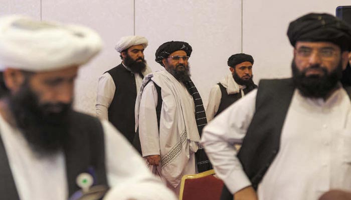 In this file photo, the Deputy Prime Minister of Afghanistan Mullah Abdul Ghani Baradar (C) stands following the final declaration of the peace talks between the Taliban and Afghan government in Doha, Qatar. — AFP/File