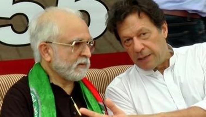 PTIs NA-245 by-poll winner Mahmood Moulvi (L) and PTI chief Imran Khan. — Twitter/@MoulviMahmood