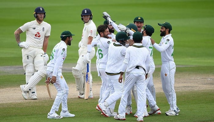 Pakistan players celebrate after taking a wicket of an England player. -AFP/File