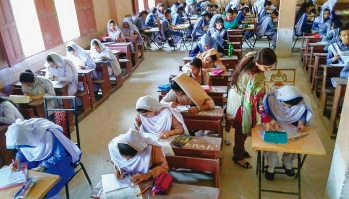 Students seated in a classroom while giving exams. — PPI/File
