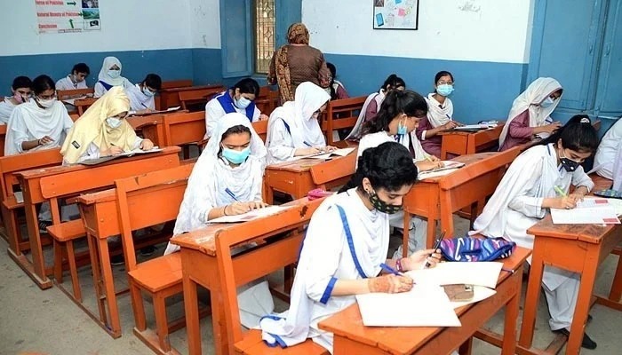 Students give an exam at the examination centre. — APP/File