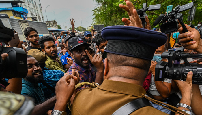 University students and demonstrators argue with police during a protest against the Sri Lankan government and for the release of student leaders in Colombo on August 30, 2022. AFP