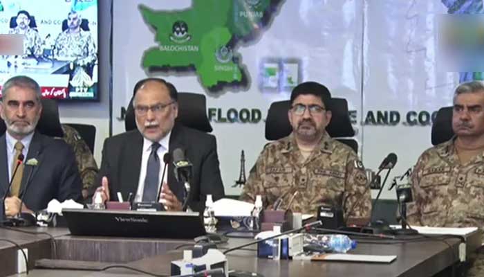 Minister for Planning Ahsan Iqbal addresses a press conference alongside military officials at the National Flood Response and Coordination Centre in Islamabad, on September 3, 2022. — YouTube/PTV