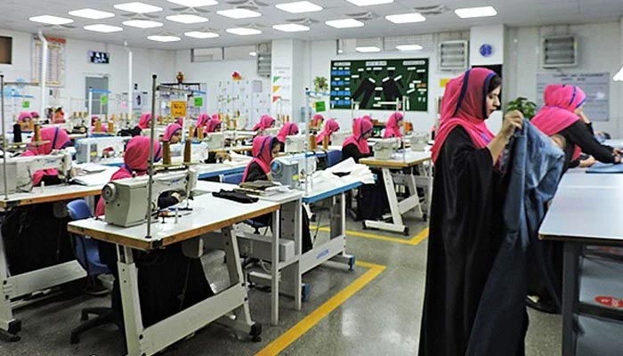 Women workers work on a factory floor in Karachi. — Twitter/File
