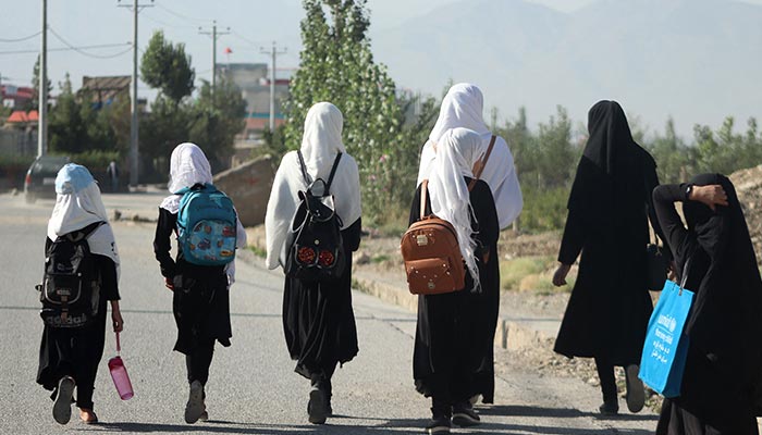 Girls walk to their school along a road in Gardez, Paktia porvince, on September 8, 2022. — AFP/File