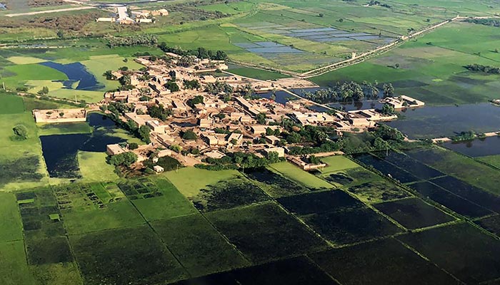 This aerial picture shows a flooded area on the outskirts of Sukkur, Sindh province, on September 10, 2022.