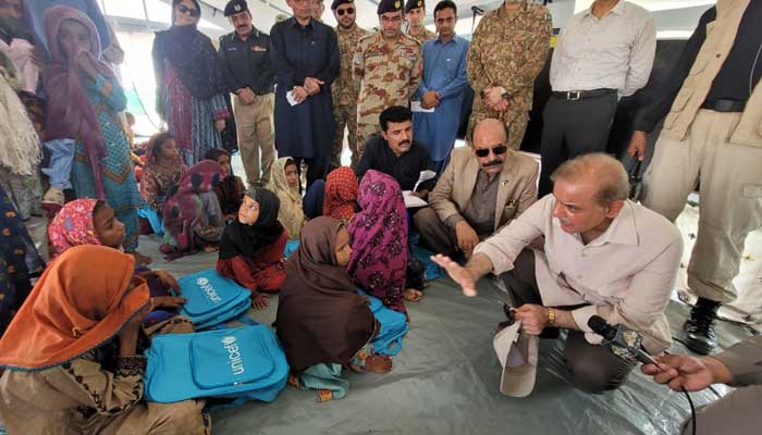 Prime Minister Shahbaz Sharif visits a school set up at the flood relief camp in District Suhbatpur on September 14. Photo: PID