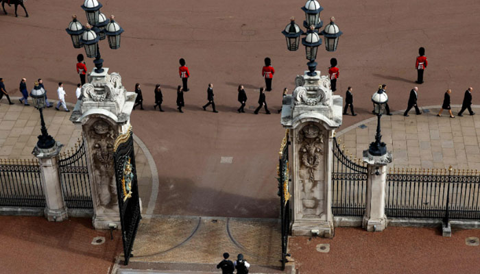 Buckingham Palace household staff pay their respects during the State Funeral of Queen Elizabeth II in London-AFP