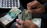 Rupee closes at record low of 239.65 against US dollar