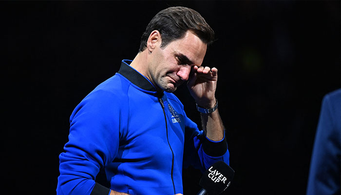 Switzerland´s Roger Federer sheds a tear during an interview after playing his final match, a doubles with Spain´s Rafael Nadal of Team Europe against USA´s Jack Sock and USA´s Frances Tiafoe of Team World in the 2022 Laver Cup at the O2 Arena in London, early on September 24, 2022. — AFP