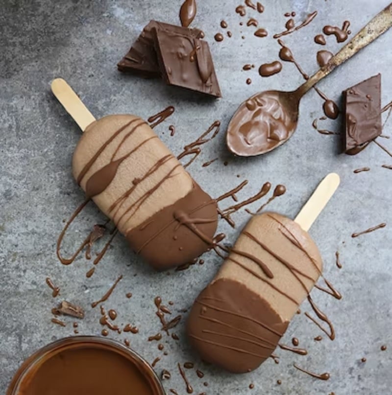 Flat laying chocolate ice cream with chocolate sauce.— Unsplash