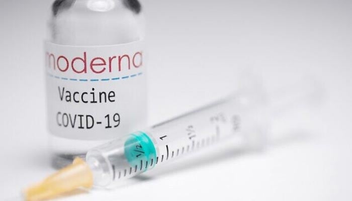 A representational image of the Moderna vaccine and a syringe. — AFP/File