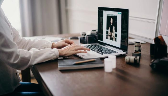 A representational image of a remote worker typing on a laptop. — Pexels/File